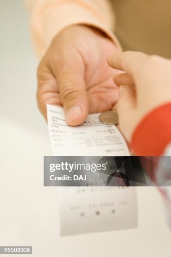 Senior man taking change and receipt Senior man taking change and receipt