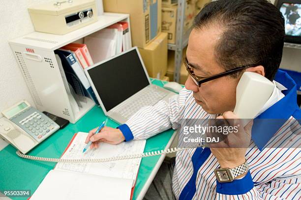 store manager on phone - itabashi ward stock pictures, royalty-free photos & images