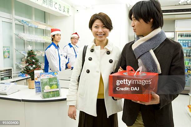 young couple leaving the store - itabashi ward stock pictures, royalty-free photos & images