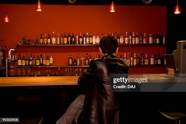 rear view of mature man in a bar - quartier d'itabashi photos et images de collection