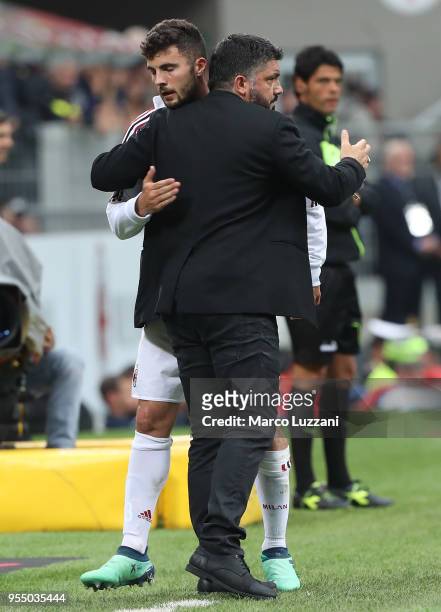 Milan coach Gennaro Gattuso embraces Patrick Cutrone of AC Milan during the serie A match between AC Milan and Hellas Verona FC at Stadio Giuseppe...