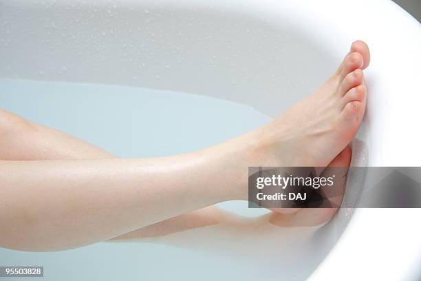 woman's feet taking a bath - japanese women bath stock pictures, royalty-free photos & images