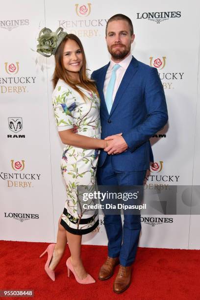 Actors Cassandra Jean and Stephen Amell attend Kentucky Derby 144 on May 5, 2018 in Louisville, Kentucky.