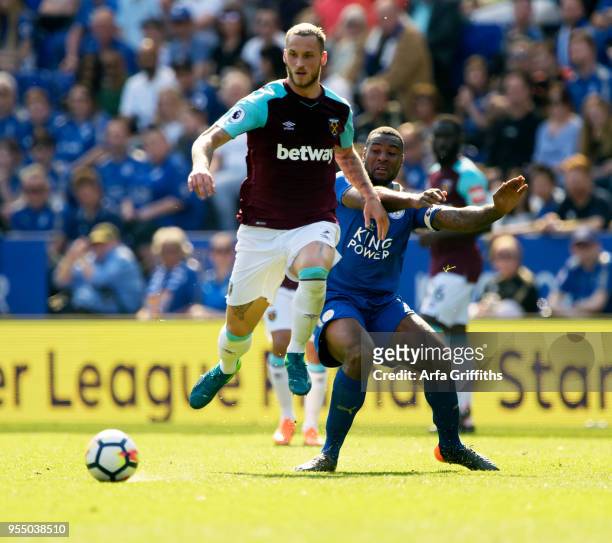 Marko Arnautovic of West Ham United in action with Wes Morgan of Leicester City during the Premier League match between Leicester City and West Ham...