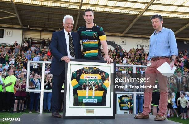 George North of Northampton Saints is presented with a club shirt after playing his last match for Northampton Saints during the Aviva Premiership...