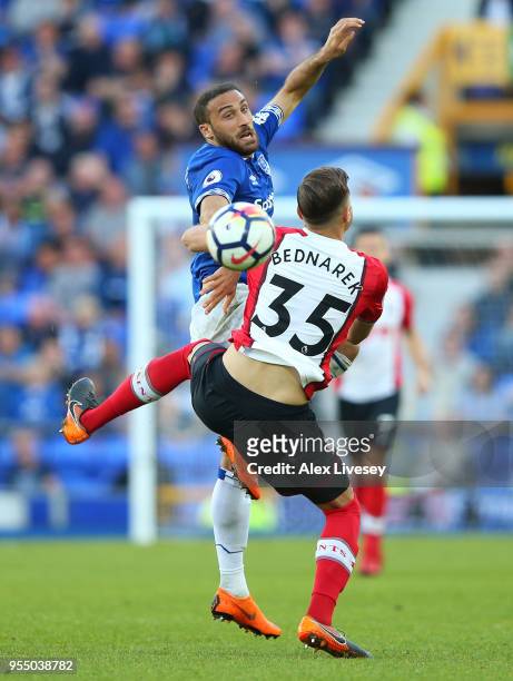 Cenk Tosun of Everton collides with Jan Bednarek of Southampton during the Premier League match between Everton and Southampton at Goodison Park on...
