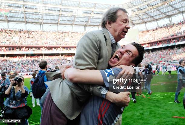 Head coach Yuri Semin and player Boris Rotenberg of FC Lokomotiv Moscow celebrate after their victory over FC Zenit Saint Petersburg in the Russian...