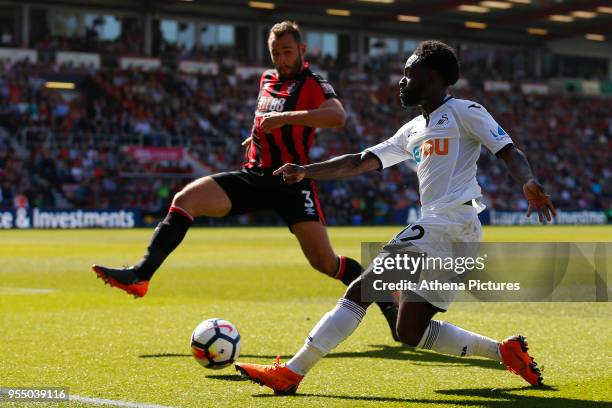 Nathan Dyer of Swansea City is marked by Steve Cook of Bournemouth during the Premier League match between AFC Bournemouth and Swansea City at...