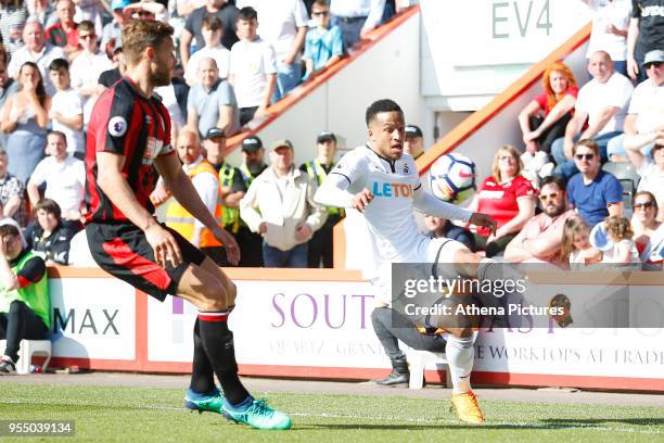 Martin Olsson of Swansea City is marked by Simon Francis of Bournemouth during the Premier League match between AFC Bournemouth and Swansea City at...