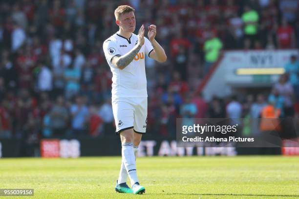 Alfie Mawson of Swansea City applauds the fan after the final whistle of the Premier League match between AFC Bournemouth and Swansea City at...