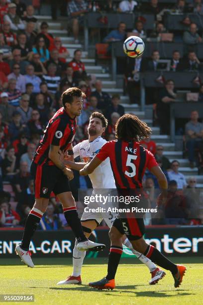 Charlie Daniels of Bournemouth and Federico Fernandez of Swansea City contend for the ball during the Premier League match between AFC Bournemouth...