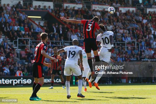 Tammy Abraham of Swansea City and Steve Cook of Bournemouth contend for the ball during the Premier League match between AFC Bournemouth and Swansea...