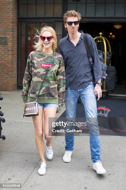 Poppy Delevingne and James Cook are seen in the East Village on May 5, 2018 in New York City.