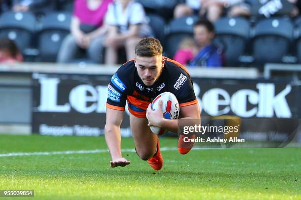 Calum Turner of Castleford Tigers scores a try during the Betfred Super League match between Hull FC and Castleford Tigers at KCOM Stadium on May 5,...
