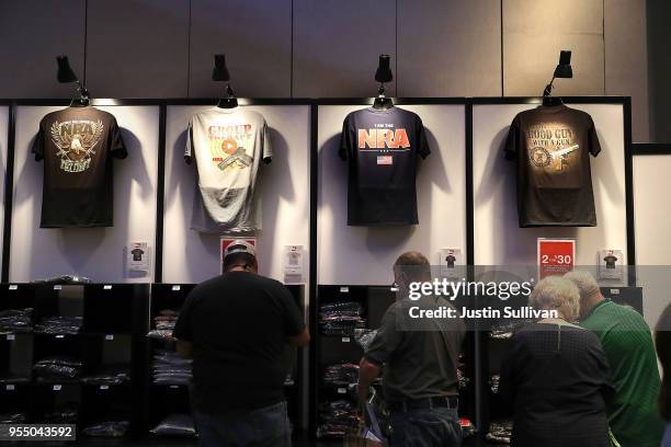 Attendees shop at the NRA store during the NRA Annual Meeting & Exhibits at the Kay Bailey Hutchison Convention Center on May 5, 2018 in Dallas,...