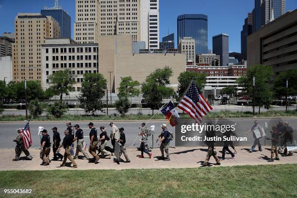 Gun rights advocates stage a demonstration outside of Dallas City Hall near the NRA Annual Meeting & Exhibits at the Kay Bailey Hutchison Convention...