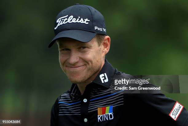 Peter Malnati shares a smile as he walks off the first green during the third round of the 2018 Wells Fargo Championship at Quail Hollow Club on May...