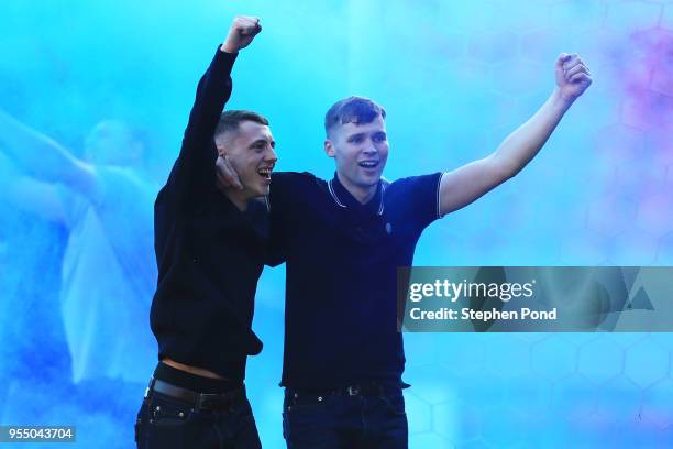 Wigan Athletic fans celebrate after the Sky Bet League One match between Doncaster Rovers and Wigan Athletic at Keepmoat Stadium on May 5, 2018 in...