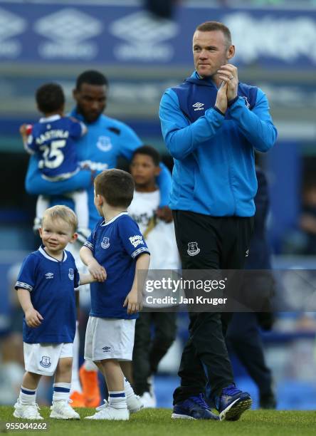 Wayne Rooney of Everton takes part in the lap of hour with his children Klay Rooney and Kit Rooney after the Premier League match between Everton and...