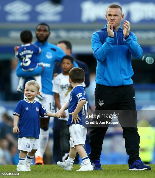 Wayne Rooney of Everton takes part in the lap of hour with his children Klay Rooney and Kit Rooney after the Premier League match between Everton and...