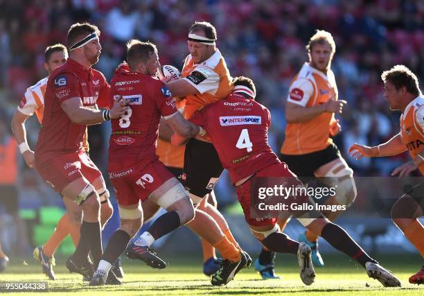 Carl Wegner of Cheetahs is tackled by John Barclay and Lewis Rawlins of Scarlets during the Guinness Pro14 match between Scarlets and Toyota Cheetahs...