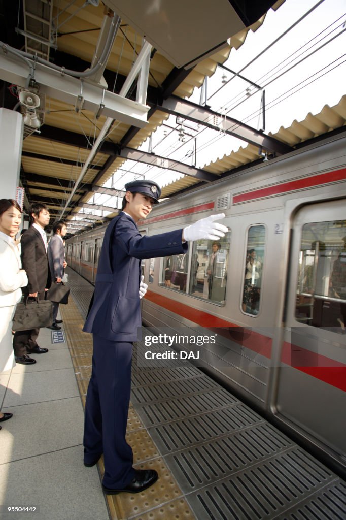 Conductor working at platform