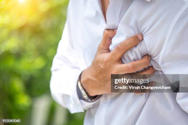 heart disease - black man heart attack stock pictures, royalty-free photos & images