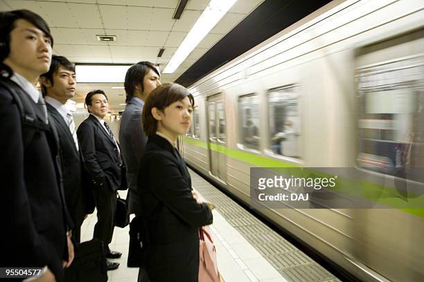 people waiting for the train at platform, blurred motion - subway platform bildbanksfoton och bilder