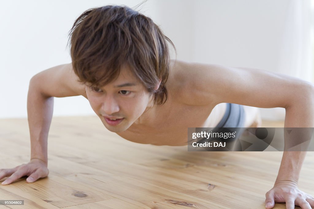 Young man doing push ups