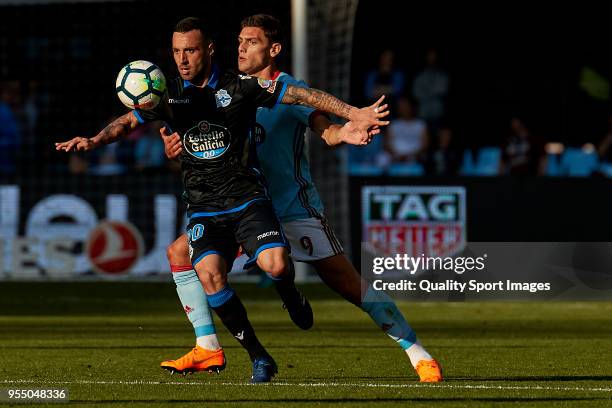 Guilherme Dos Santos of Deportivo de La Coruna is challenged by Lucas Boye of Celta de Vigo during the La Liga match between Celta de Vigo and...