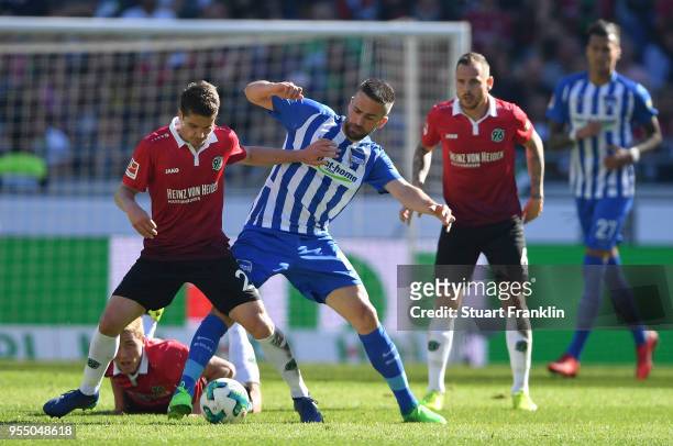 Pirmin Schwegler of Hannover is challenged by Vedad Ibisevic of Berlin during the Bundesliga match between Hannover 96 and Hertha BSC at HDI-Arena on...