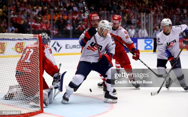 Oliver Bjorkstrand of Denmark and Cam Atkinson of United States battle for the puck during the 2018 IIHF Ice Hockey World Championship group stage...
