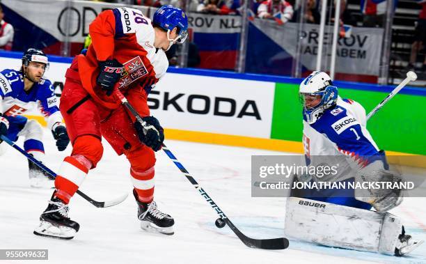 Czech Republic's Dominik Kubalik strikes in front of Slovakia's goalie Marek Ciliak during the group A match Czech Republic vs Slovakia of the 2018...