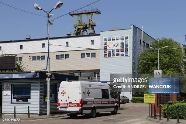 An ambulance drives near the Zofiowka mine after its was hit by a quake on May 5, 2018 in Jastrzebie-Zdroj, in the Polish southern Silesia region. -...