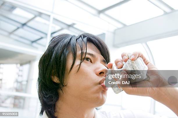 young man drinking juice - juice box stock pictures, royalty-free photos & images