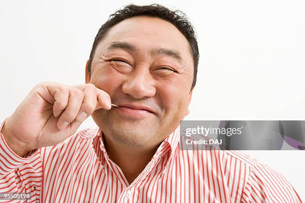 Man Using Toothpick Photos and Premium High Res Pictures - Getty Images