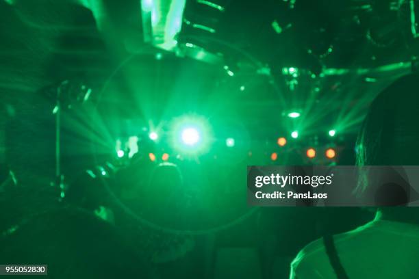 blur crowd audience at music concert - light blur stock-fotos und bilder