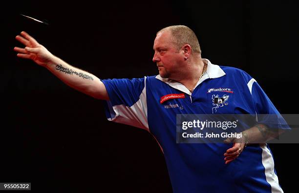 Andy Hamilton of England in action against James Wade of England during the 2010 Ladbrokes.com World Darts Championships at Alexandra Palace on...