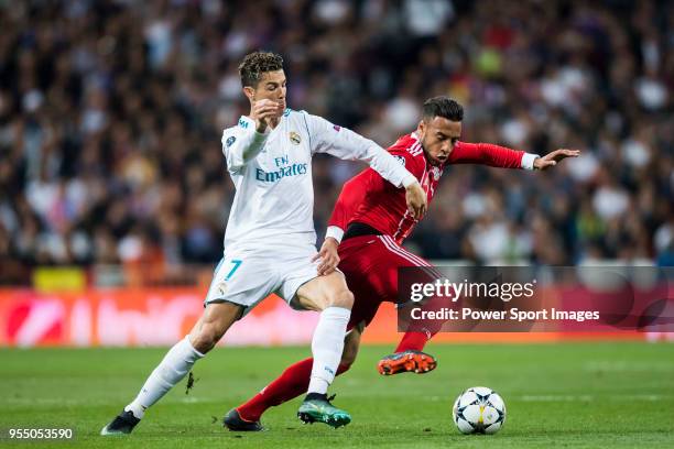 Cristiano Ronaldo of Real Madrid fights for the ball with Corentin Tolisso of FC Bayern Munich during the UEFA Champions League Semi Final Second Leg...