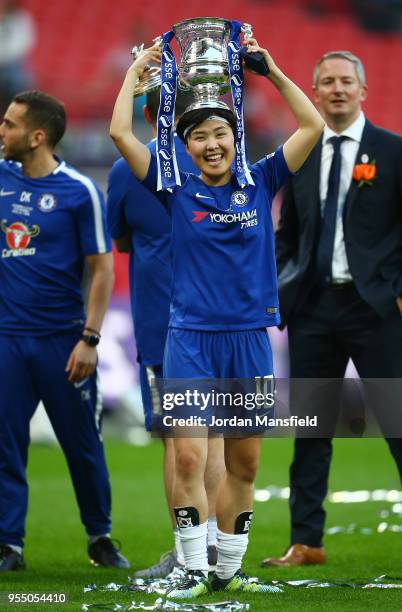 Ji So-Yun of Chelsea celebrates with the trophy during the SSE Women's FA Cup Final match between Arsenal Women and Chelsea Ladies at Wembley Stadium...