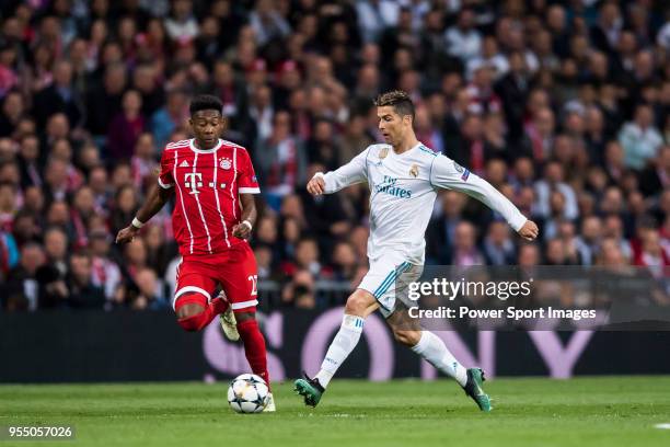 Cristiano Ronaldo of Real Madrid competes for the ball with David Alaba of FC Bayern Munich during the UEFA Champions League Semi Final Second Leg...