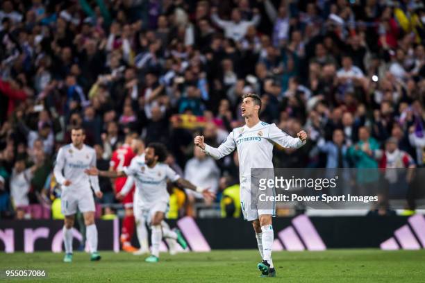 Cristiano Ronaldo of Real Madrid celebrates at the full time during the UEFA Champions League Semi Final Second Leg match between Real Madrid and...