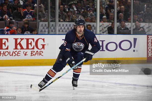 Zack Stortini of the Edmonton Oilers skates on the forecheck during their NHL game against the St. Louis Blues on December 21, 2009 at Rexall Place...