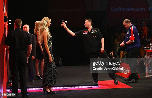 Kevin Painter of England practices before his game against Raymond Van Barneveld of Netherlands during the 2010 Ladbrokes.com World Darts...