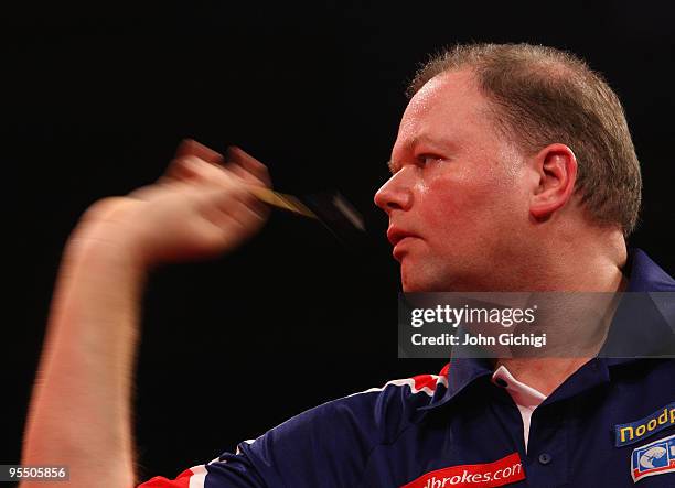 Raymond Van Barneveld of Netherlands in action against Kevin Painter of England during the 2010 Ladbrokes.com World Darts Championships at Alexandra...