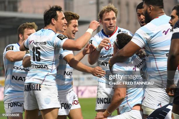 Racing 92's players jubilate after scoring during the French Top 14 rugby union match between Racing 92 and SU Agen, at La Rabine Stadium in Vannes,...