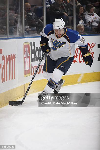 Andy McDonald of the St. Louis Blues plays the puck behind the net during their NHL game against the Edmonton Oilers on December 21, 2009 at Rexall...