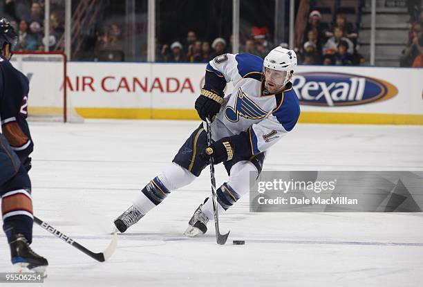 Andy McDonald of the St. Louis Blues plays the puck across the blueline during their NHL game against the Edmonton Oilers on December 21, 2009 at...