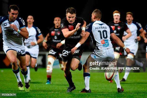 Lyon's New Zealander winger Toby Arnold runs for the ball during the French Top 14 rugby union match between Lyon and Montpellier on May 5, 2018 at...