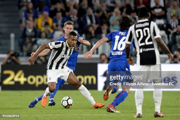 Alex Sandro of Juventus competes for the ball with Emil Krafth of Bologna FC during the serie A match between Juventus and Bologna FC at Allianz...